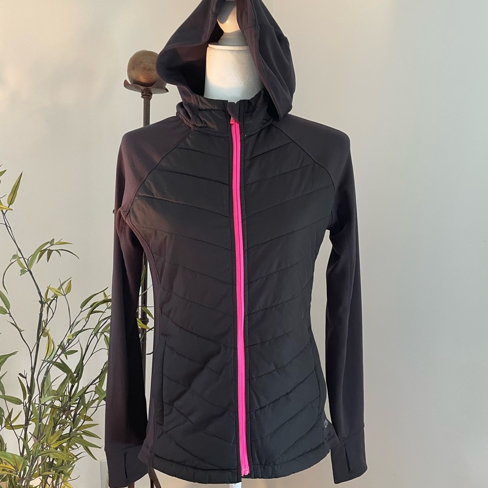 Light weight zip up jacket with hood and thumb holes.